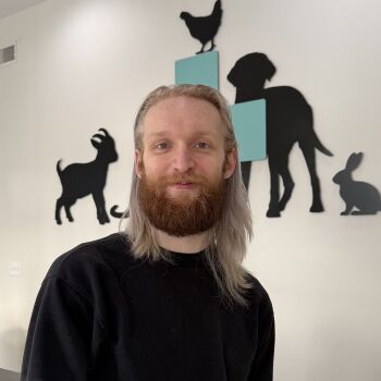 andrew standing at the front desk